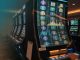 Macro editorial photograph inside a modern slot machine cabinet, focusing on the motherboard and